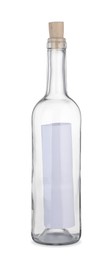 Photo of Corked glass bottle with rolled letter isolated on white