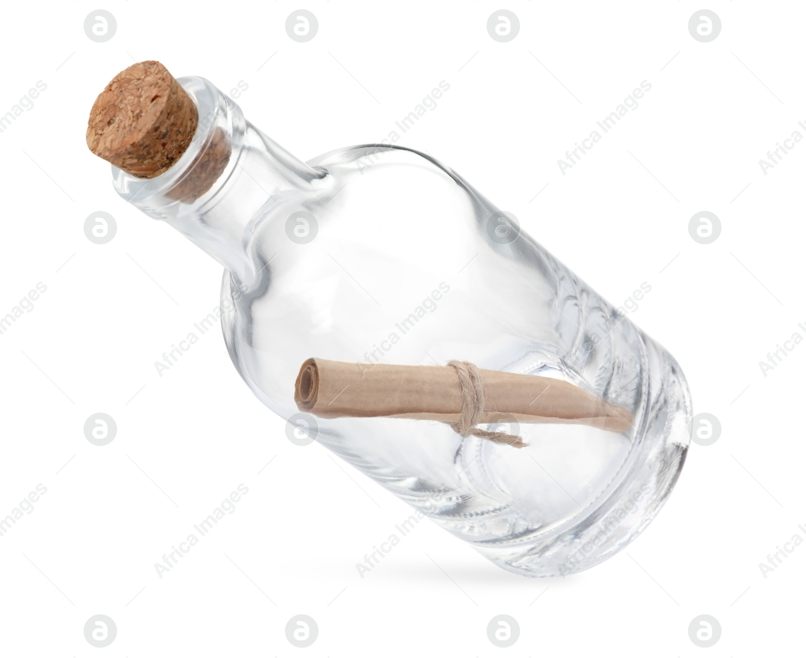 Photo of Corked glass bottle with rolled letter in air isolated on white