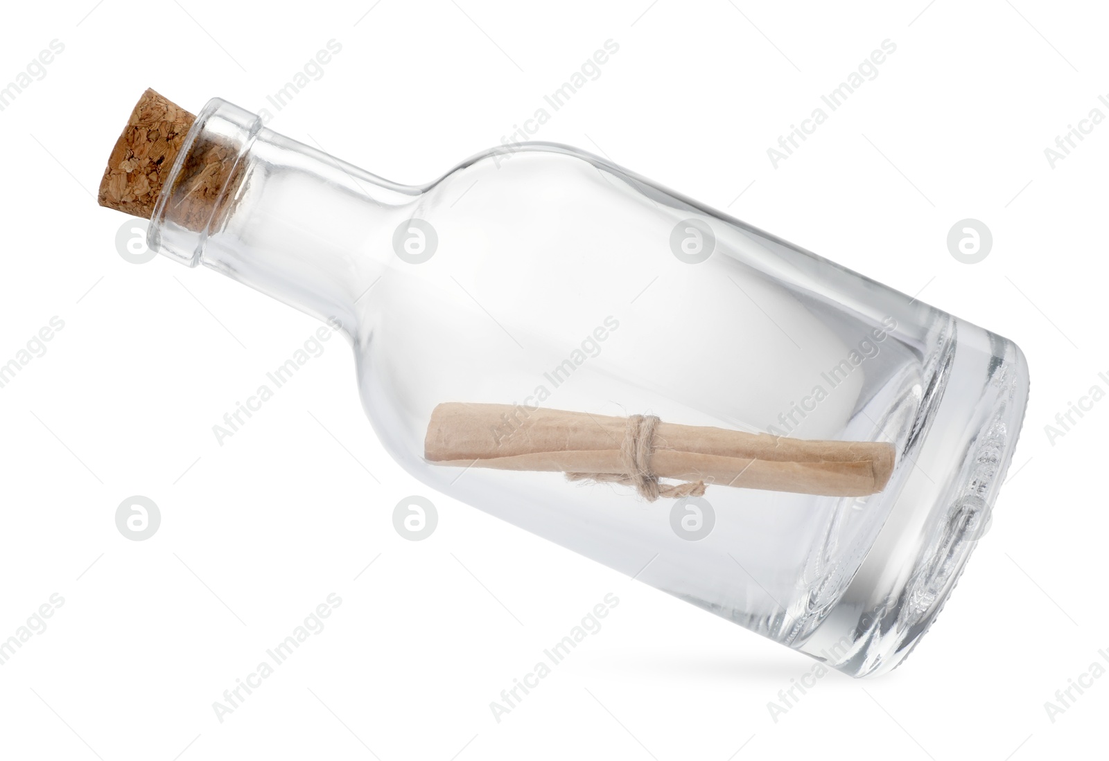 Photo of Corked glass bottle with rolled letter in air isolated on white