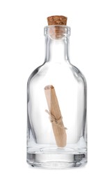 Photo of Corked glass bottle with rolled letter isolated on white