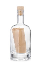 Photo of Corked glass bottle with rolled letter isolated on white