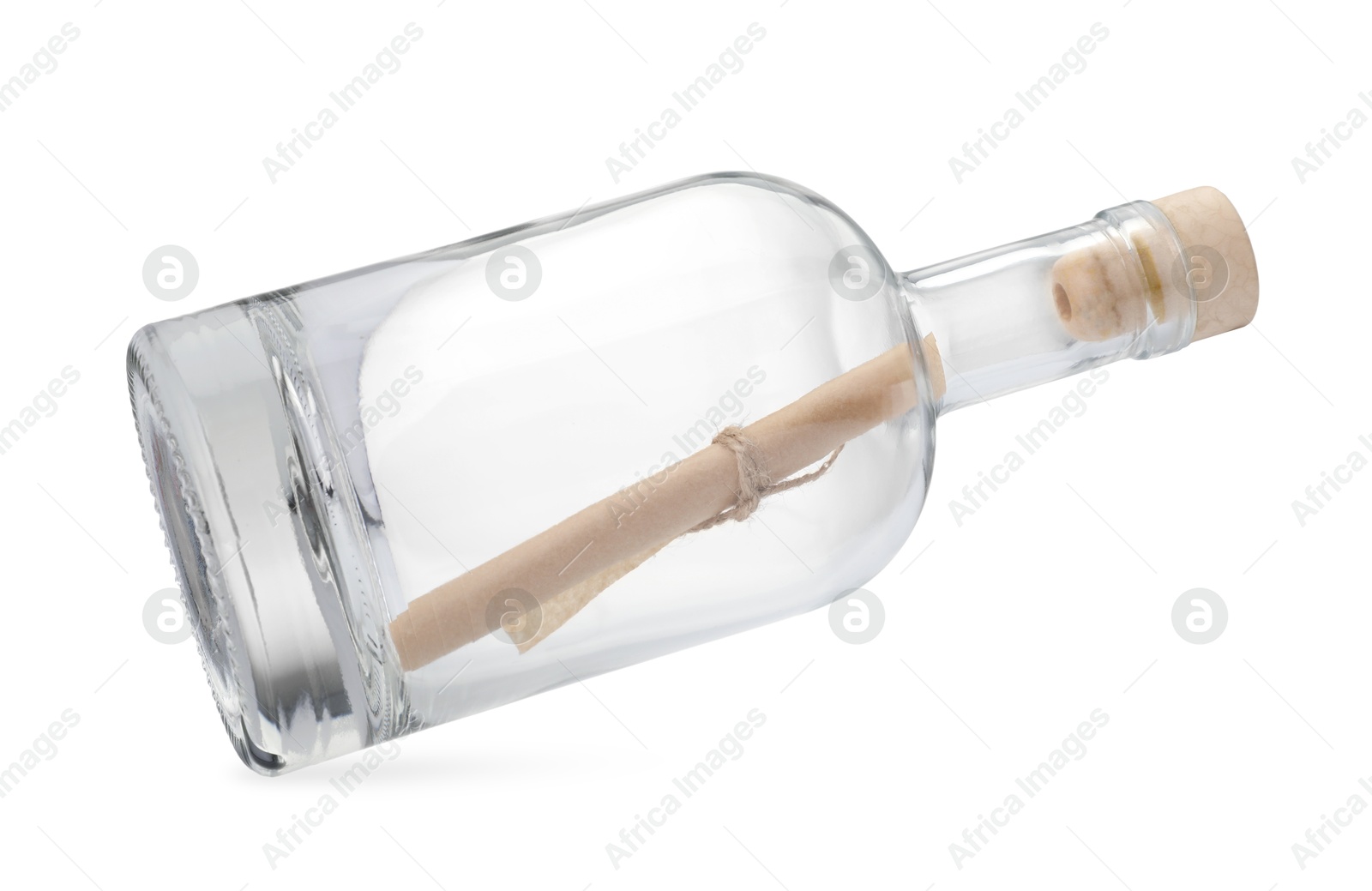 Photo of Corked glass bottle with rolled letter in air isolated on white