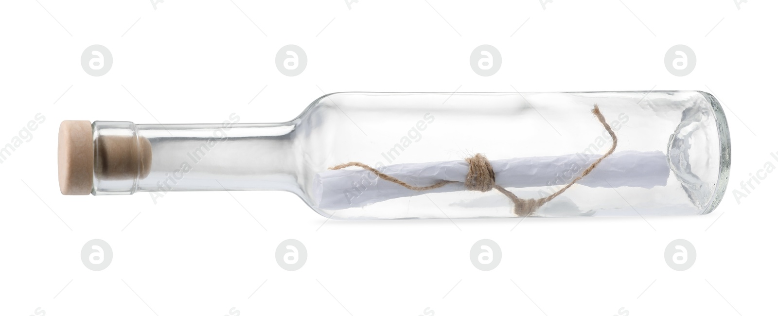 Photo of Corked glass bottle with rolled letter isolated on white