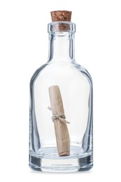 Photo of Corked glass bottle with rolled letter isolated on white