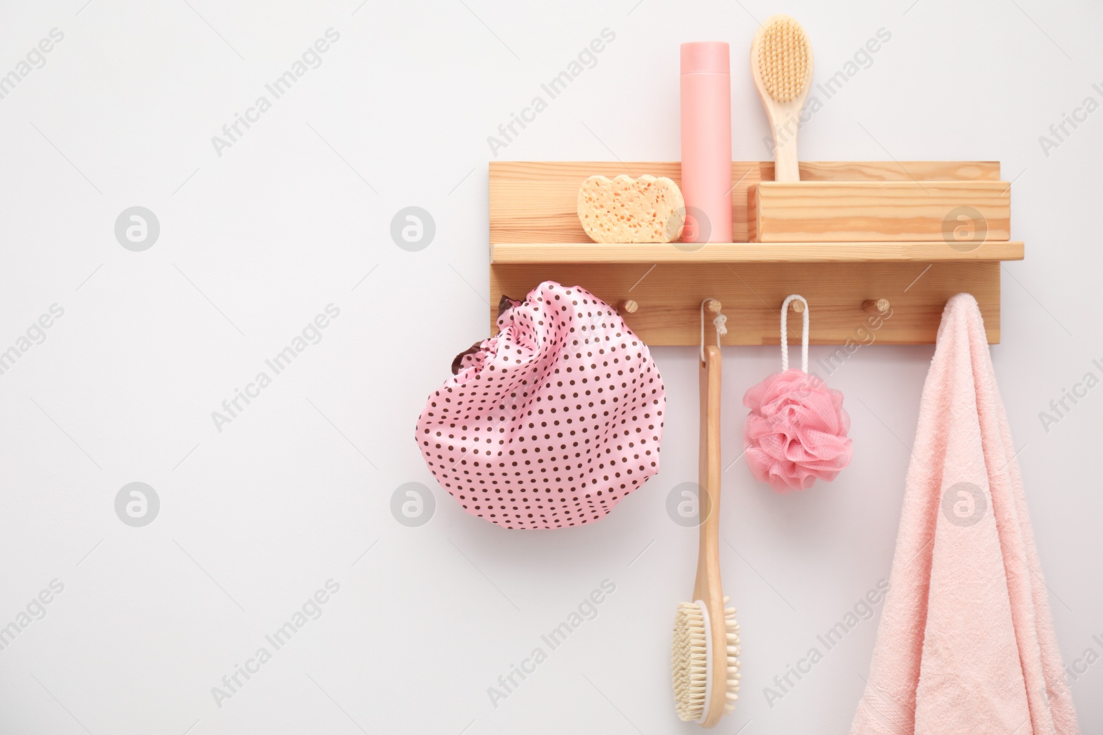 Photo of Shower cap and bath accessories in bathroom