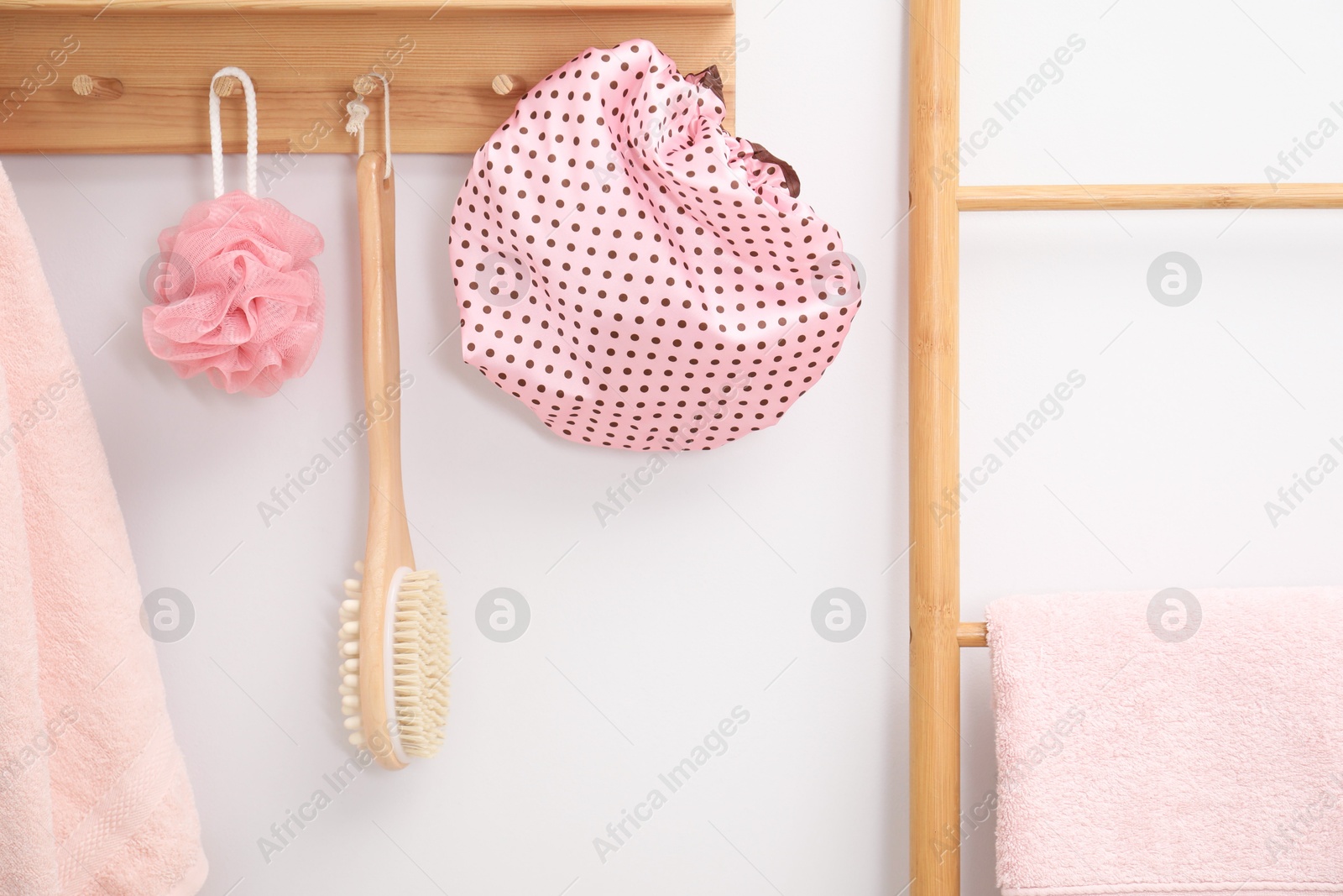 Photo of Shower cap and bath accessories in bathroom