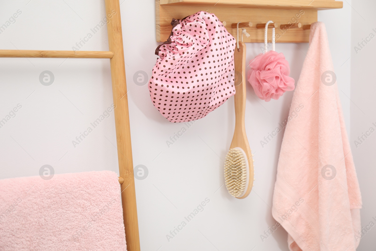 Photo of Shower cap and bath accessories in bathroom