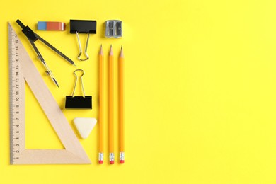 Photo of Flat lay composition with ruler and other stationery on yellow background, space for text