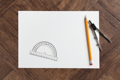 Photo of Ruler, paper, compass and pencil on wooden table, flat lay. Space for text