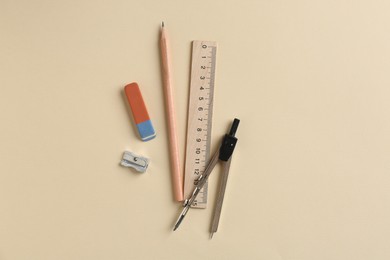 Photo of Flat lay composition with ruler and other stationery on beige background