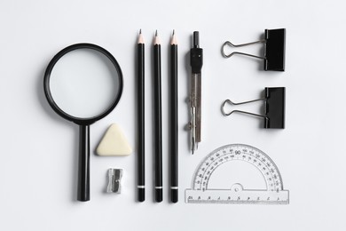 Photo of Flat lay composition with ruler and other stationery on white background