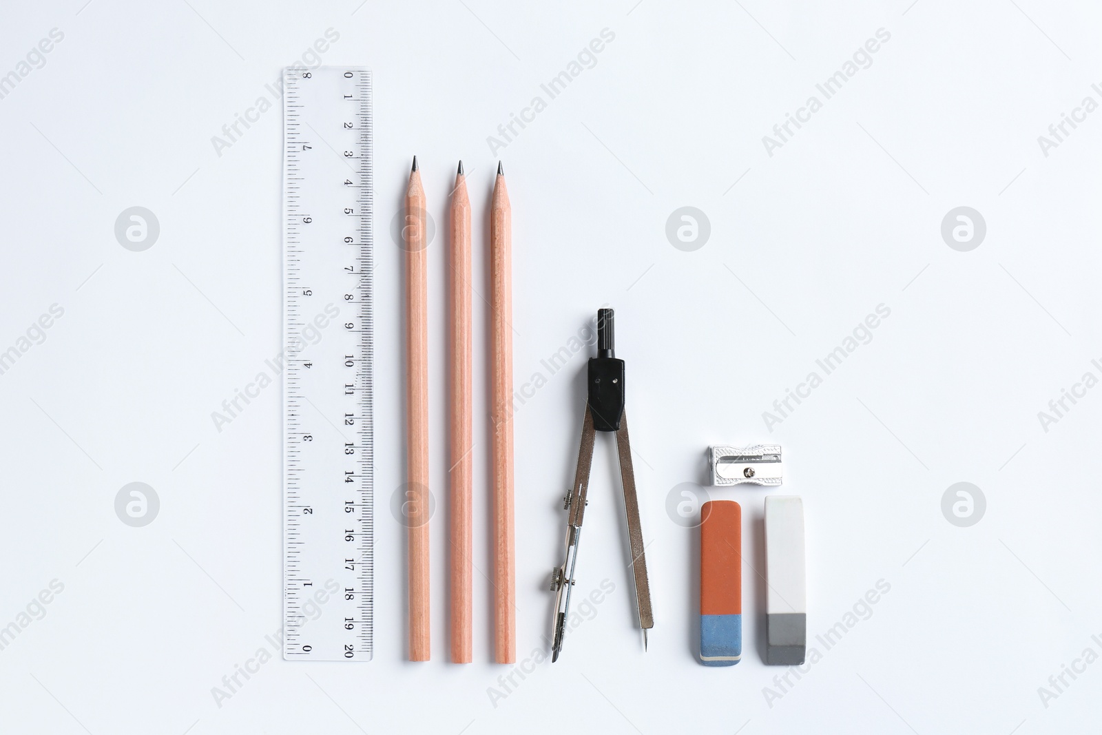 Photo of Flat lay composition with ruler and other stationery on white background