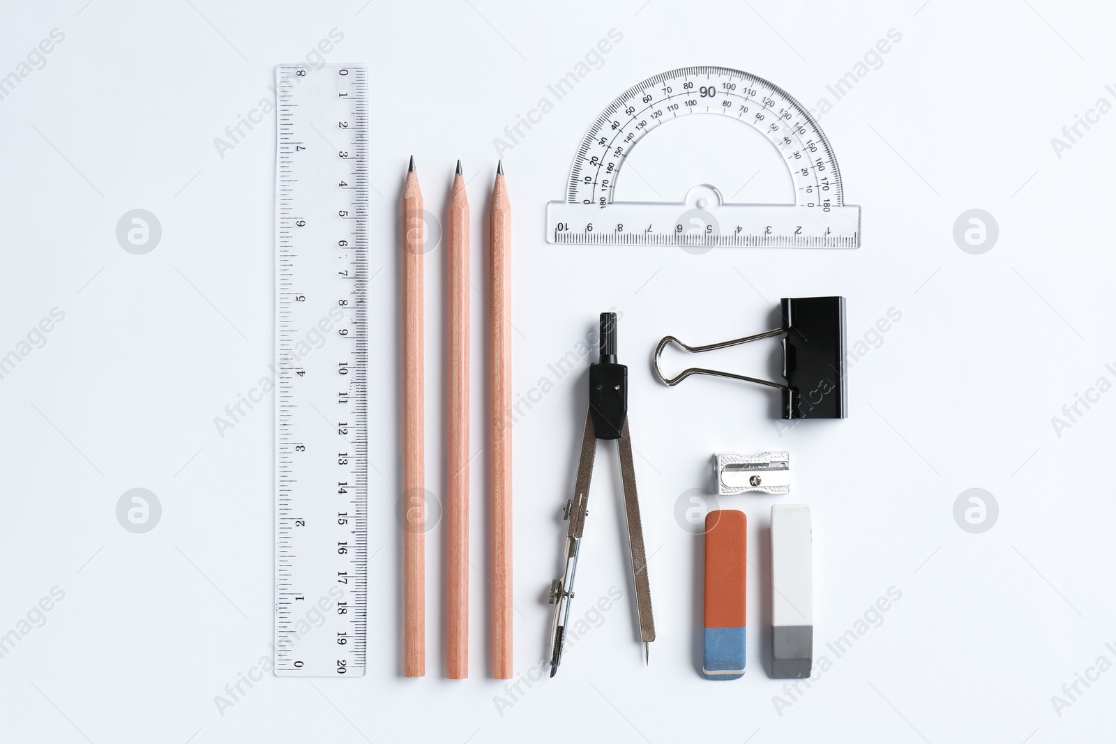 Photo of Flat lay composition with ruler and other stationery on white background