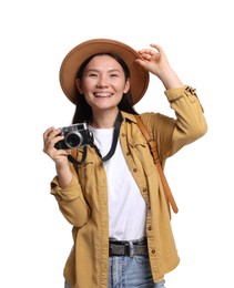 Photo of Happy traveller with camera on white background