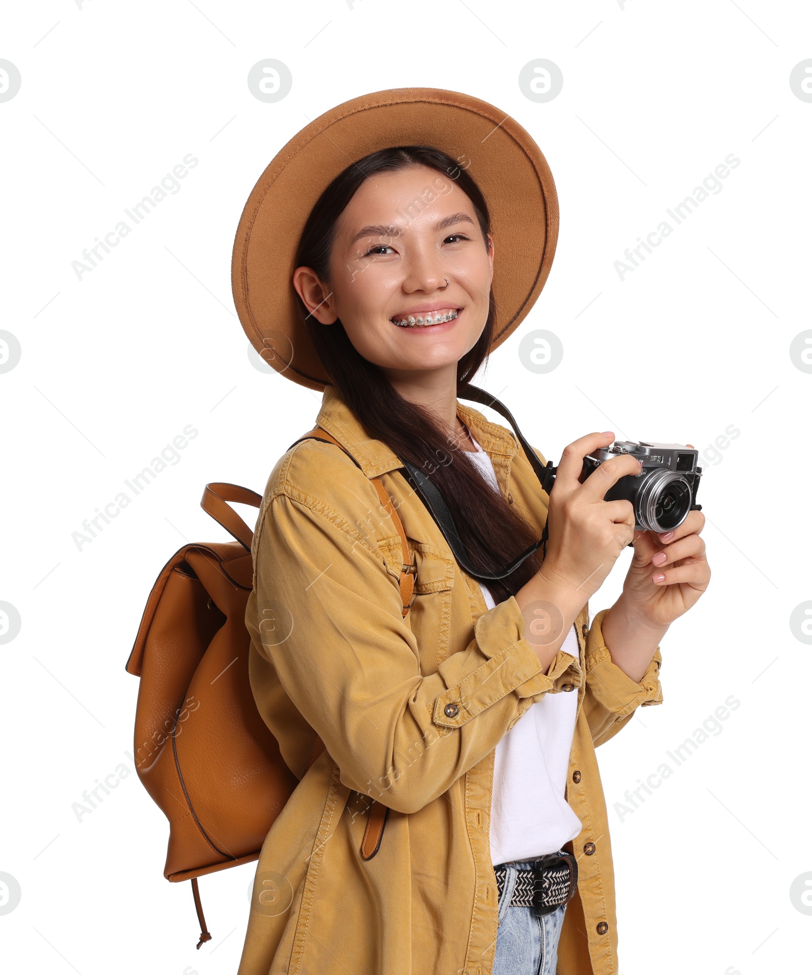 Photo of Traveller with backpack taking photo on white background