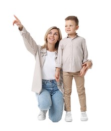 Photo of Happy mother with her cute little son looking at something on white background