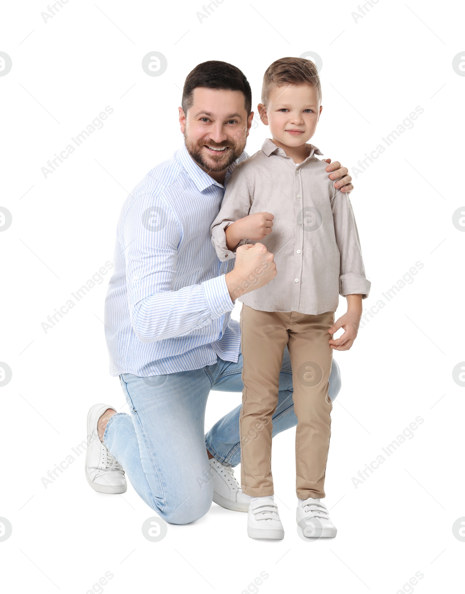 Photo of Happy father with his cute little son on white background