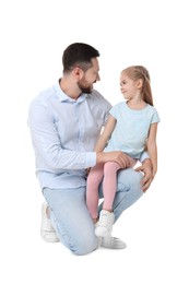 Photo of Happy father with his cute little daughter on white background