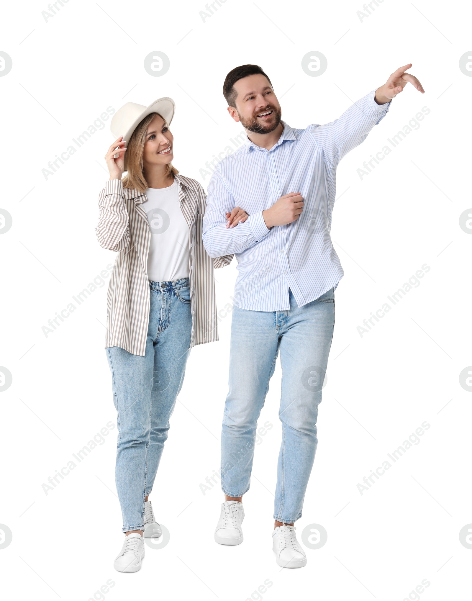 Photo of Happy couple looking at something on white background