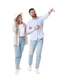 Photo of Happy couple looking at something on white background