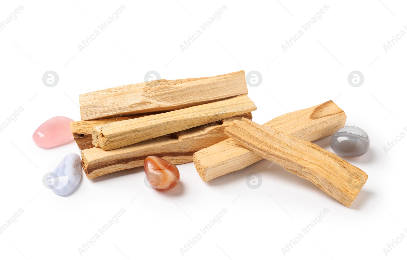 Photo of Palo santo sticks and gemstones isolated on white