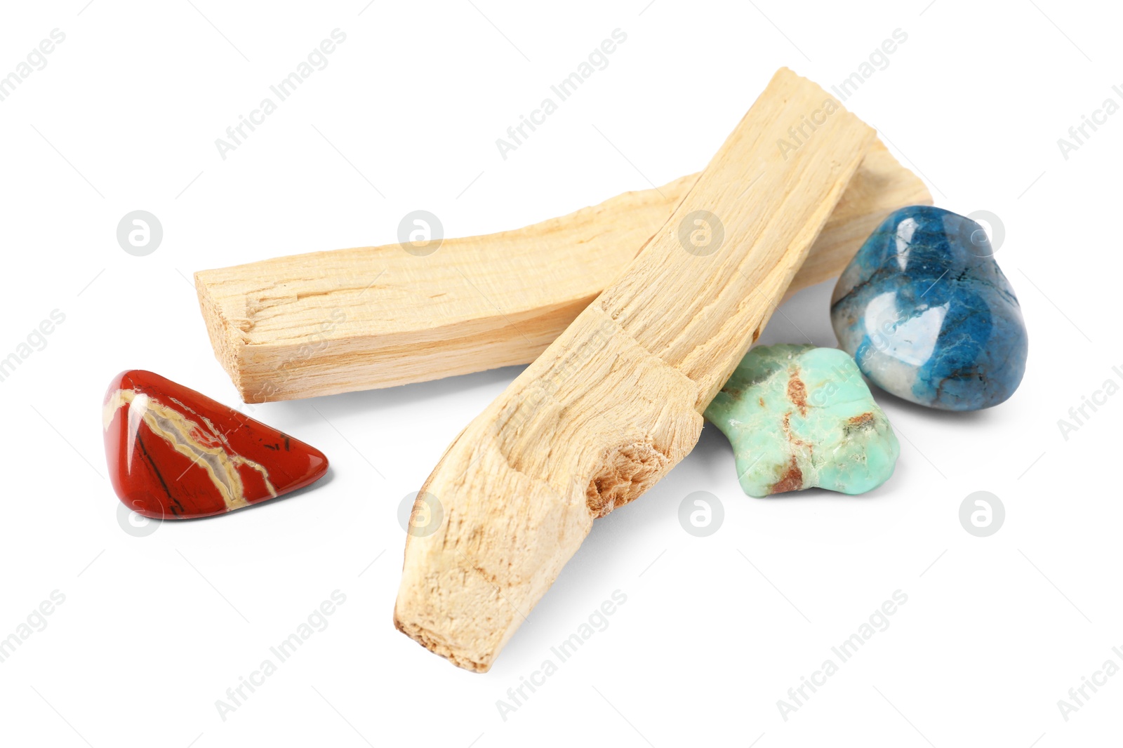 Photo of Palo santo sticks and gemstones isolated on white