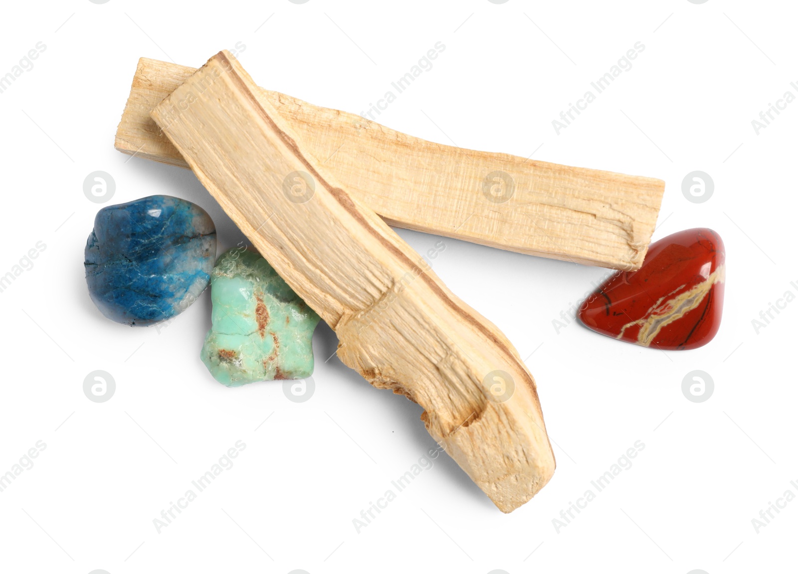 Photo of Palo santo sticks and gemstones isolated on white, top view