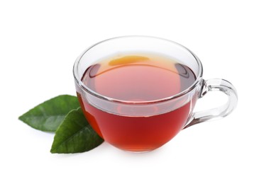 Photo of Refreshing black tea in cup and leaves isolated on white