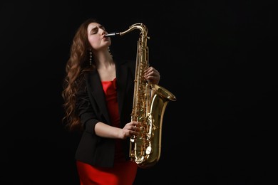 Professional musician playing saxophone on black background