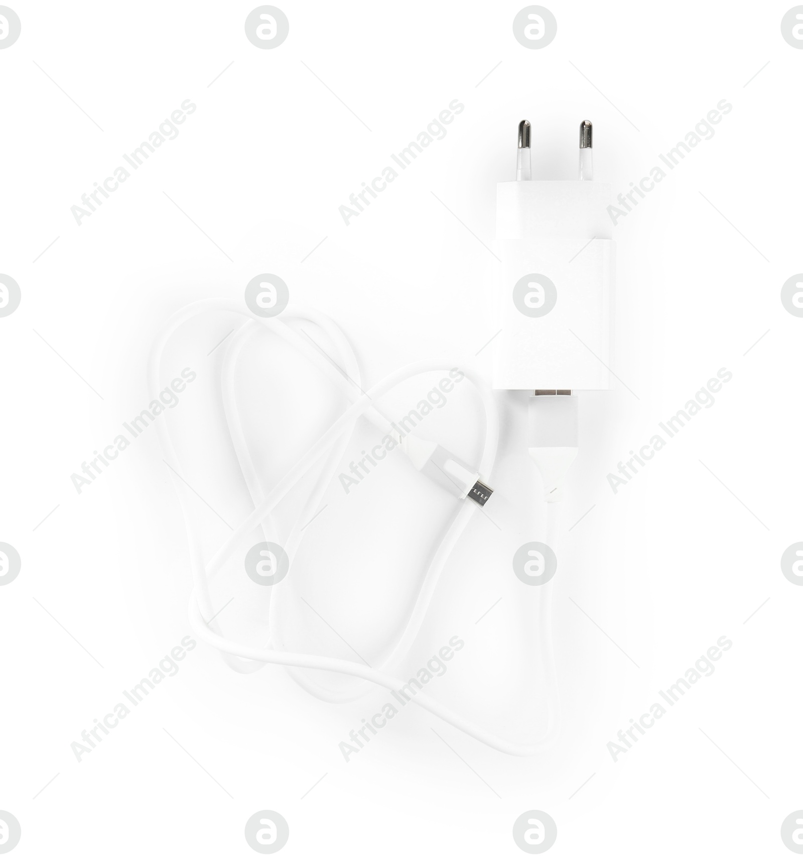 Photo of USB power adapter with charge cable isolated on white, top view