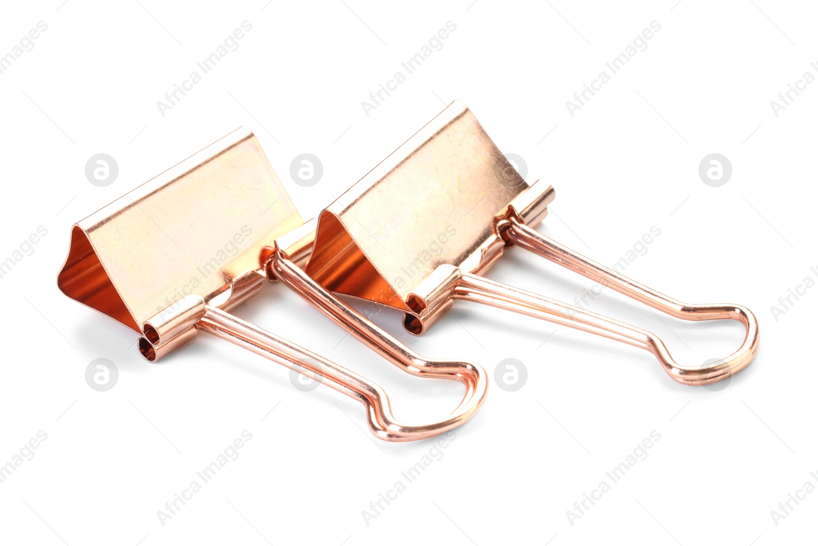 Photo of Two golden binder clips isolated on white