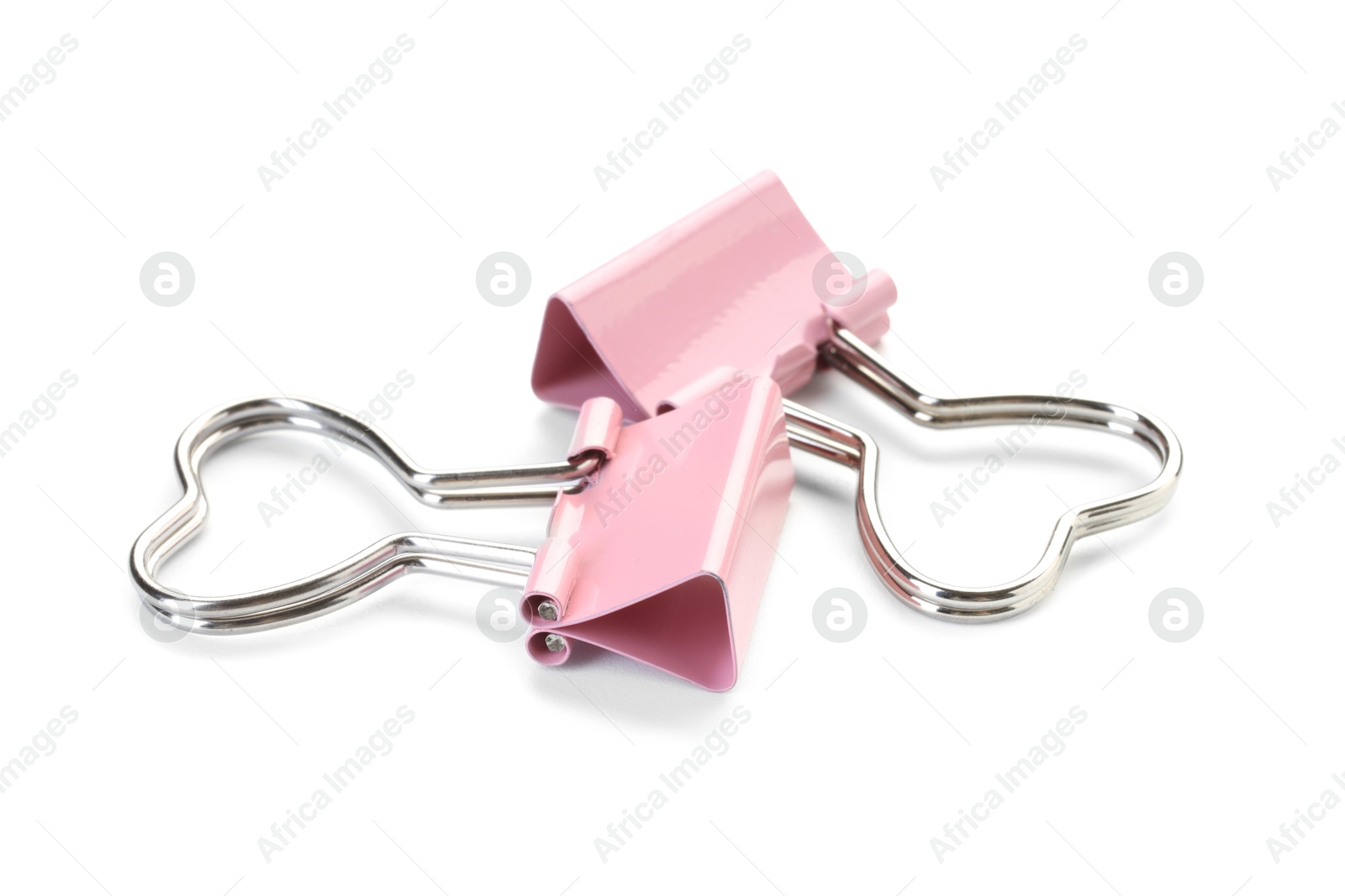 Photo of Heart shaped binder clips isolated on white