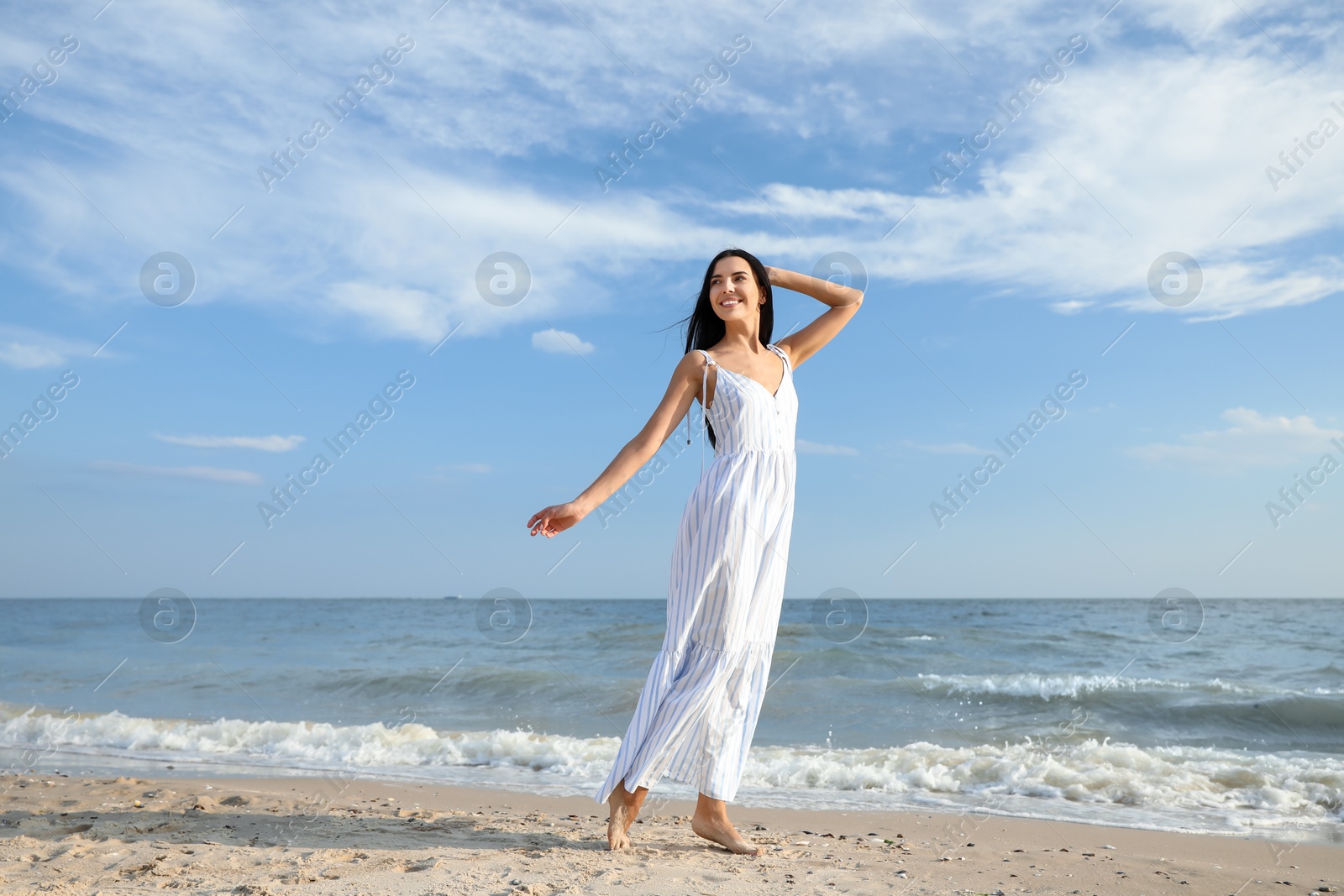 Photo of Young beautiful woman at beach on sunny day