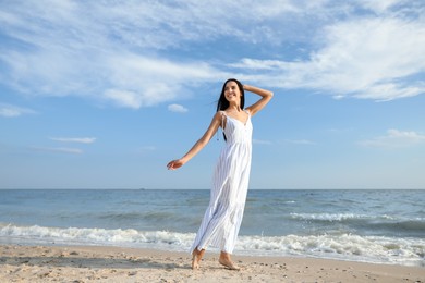 Photo of Young beautiful woman at beach on sunny day