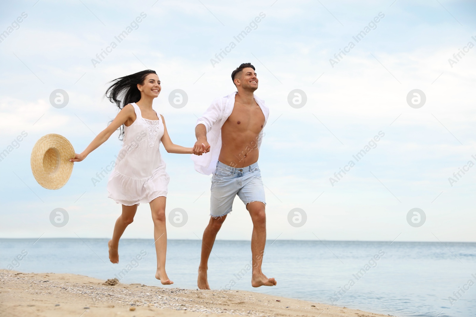 Photo of Lovely couple having fun on beautiful beach