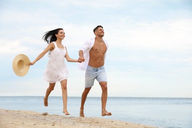 Photo of Lovely couple having fun on beautiful beach