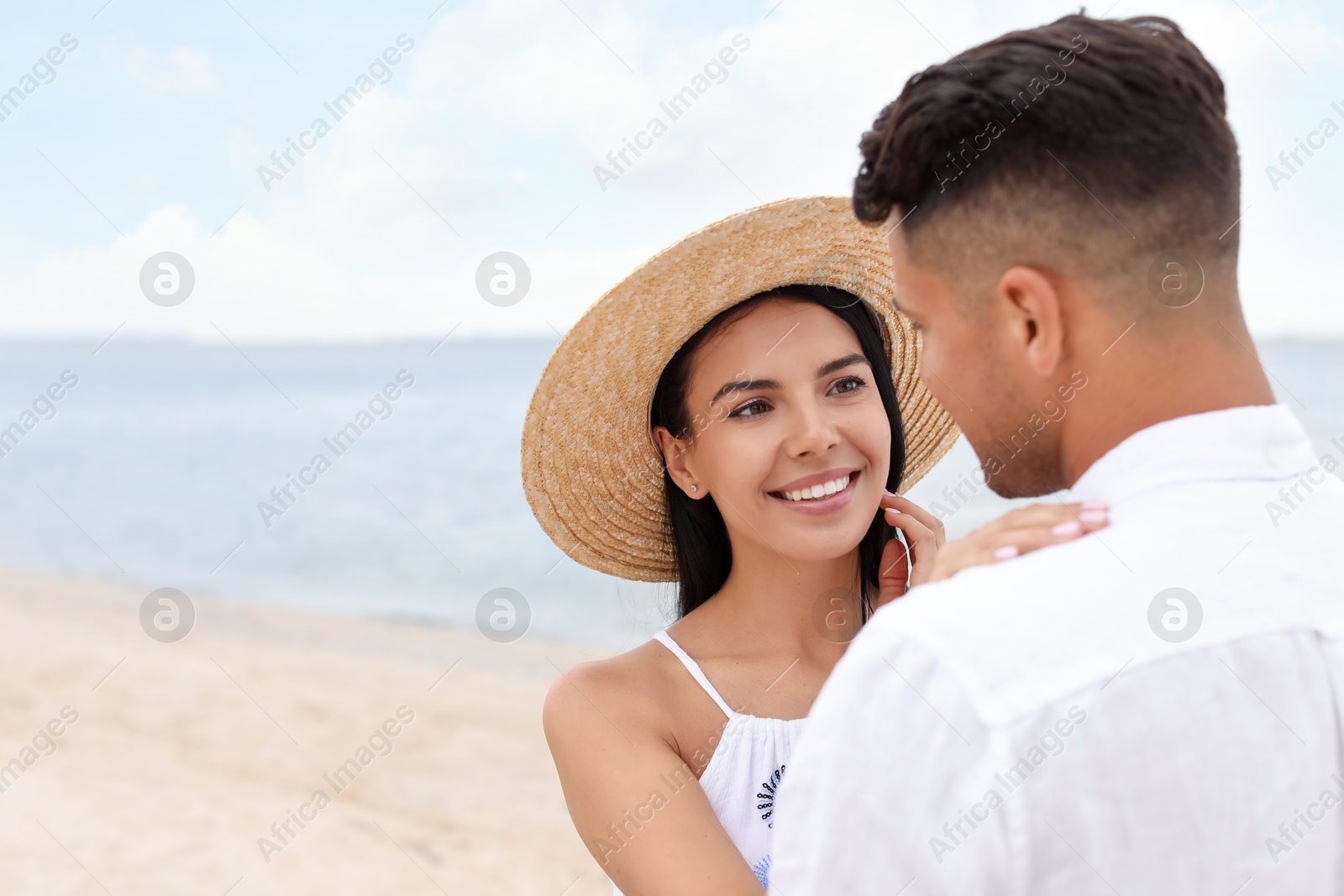 Photo of Lovely couple spending time together on beach