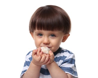 Photo of Cute little child eating tasty mochi on white background