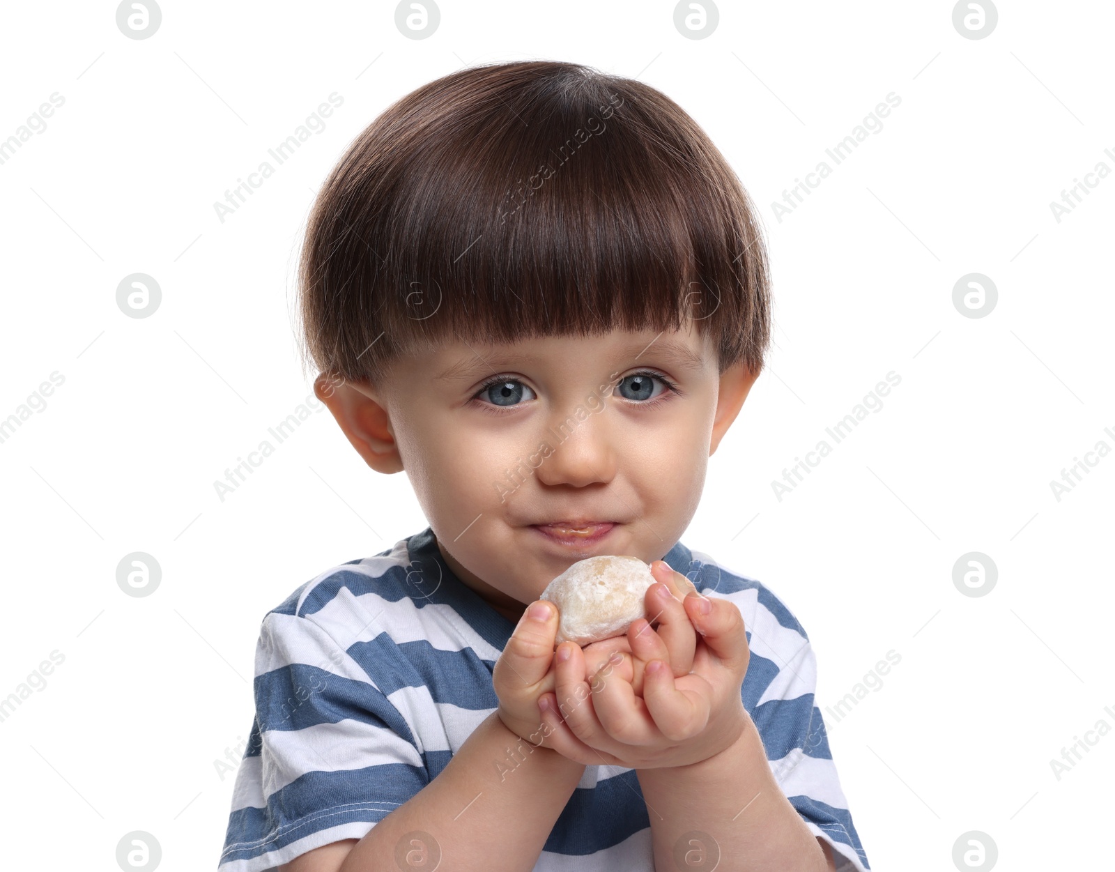 Photo of Cute little child eating tasty mochi on white background