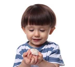 Cute little child with tasty mochi on white background