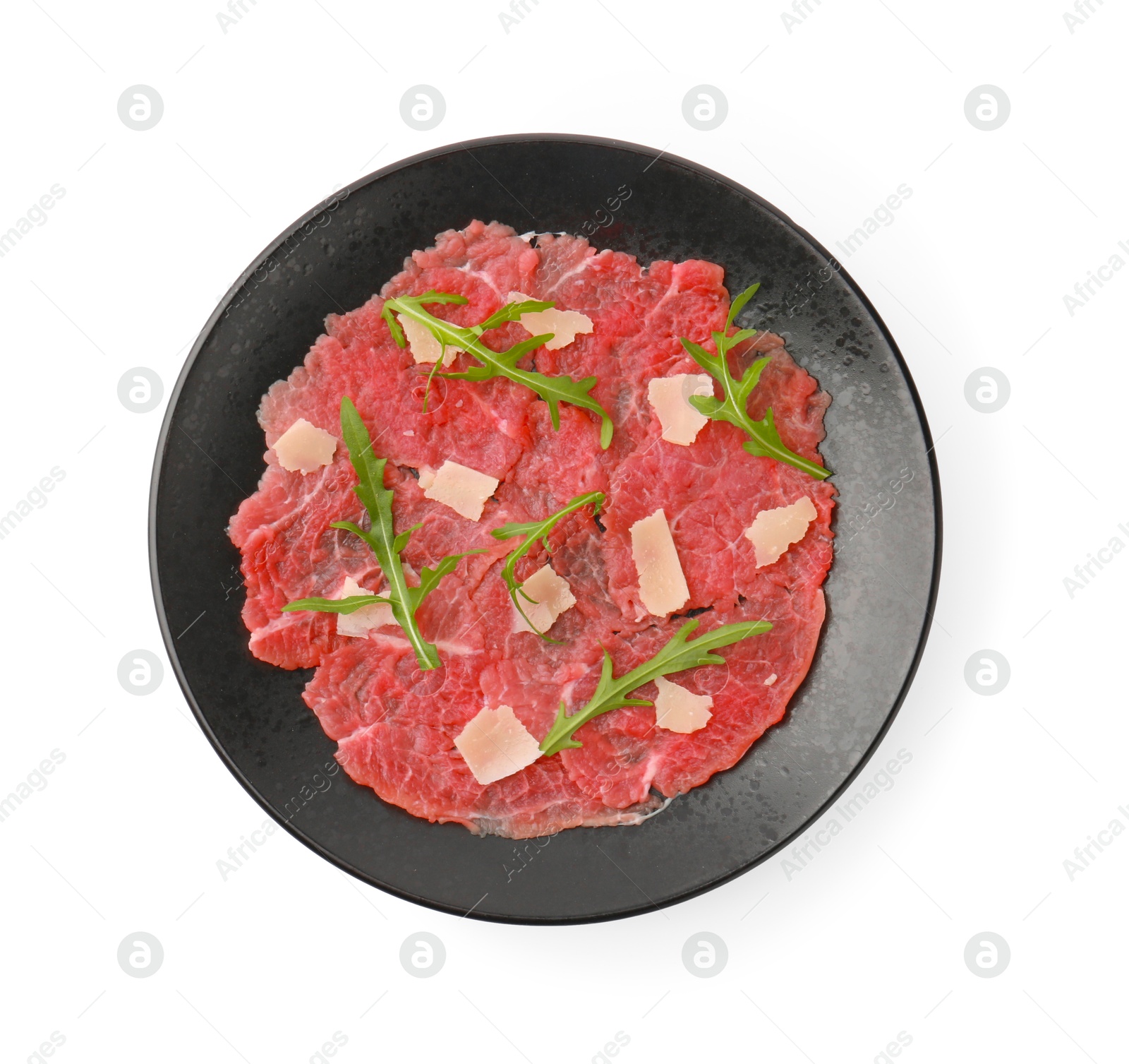 Photo of Fresh beef carpaccio with arugula and cheese isolated on white, top view