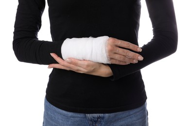 Photo of Woman with medical bandage on wrist against white background, closeup