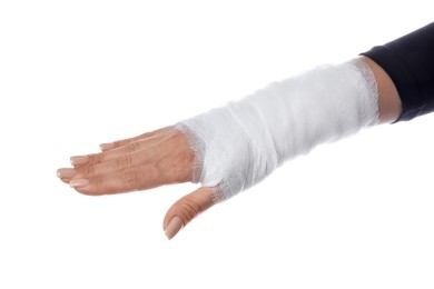 Photo of Woman with medical bandage on wrist against white background, closeup