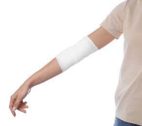 Photo of Woman with medical bandage on elbow against white background, closeup