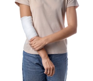 Photo of Woman with medical bandage on elbow against white background, closeup