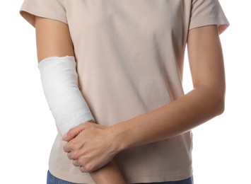 Photo of Woman with medical bandage on elbow against white background, closeup