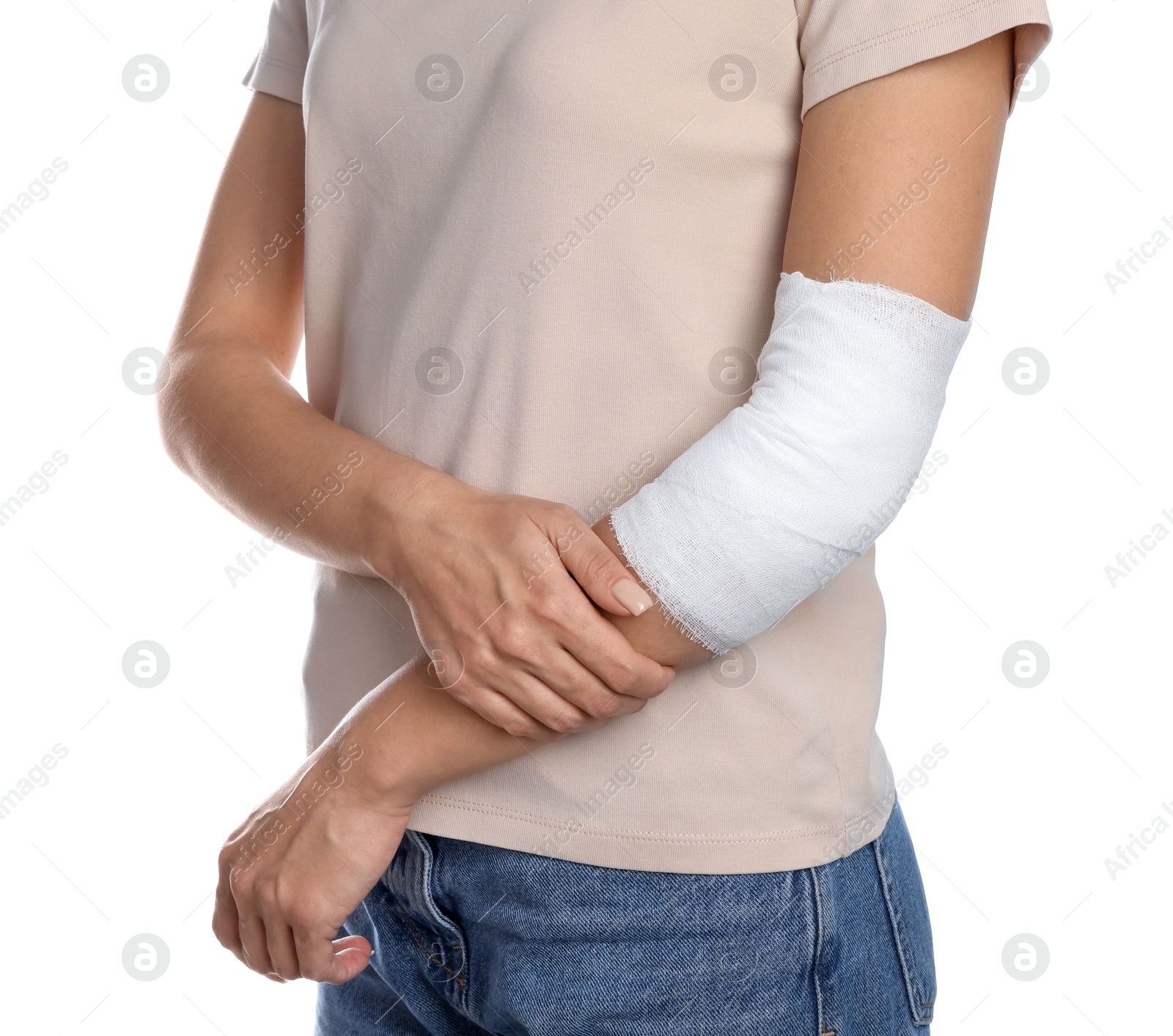 Photo of Woman with medical bandage on elbow against white background, closeup