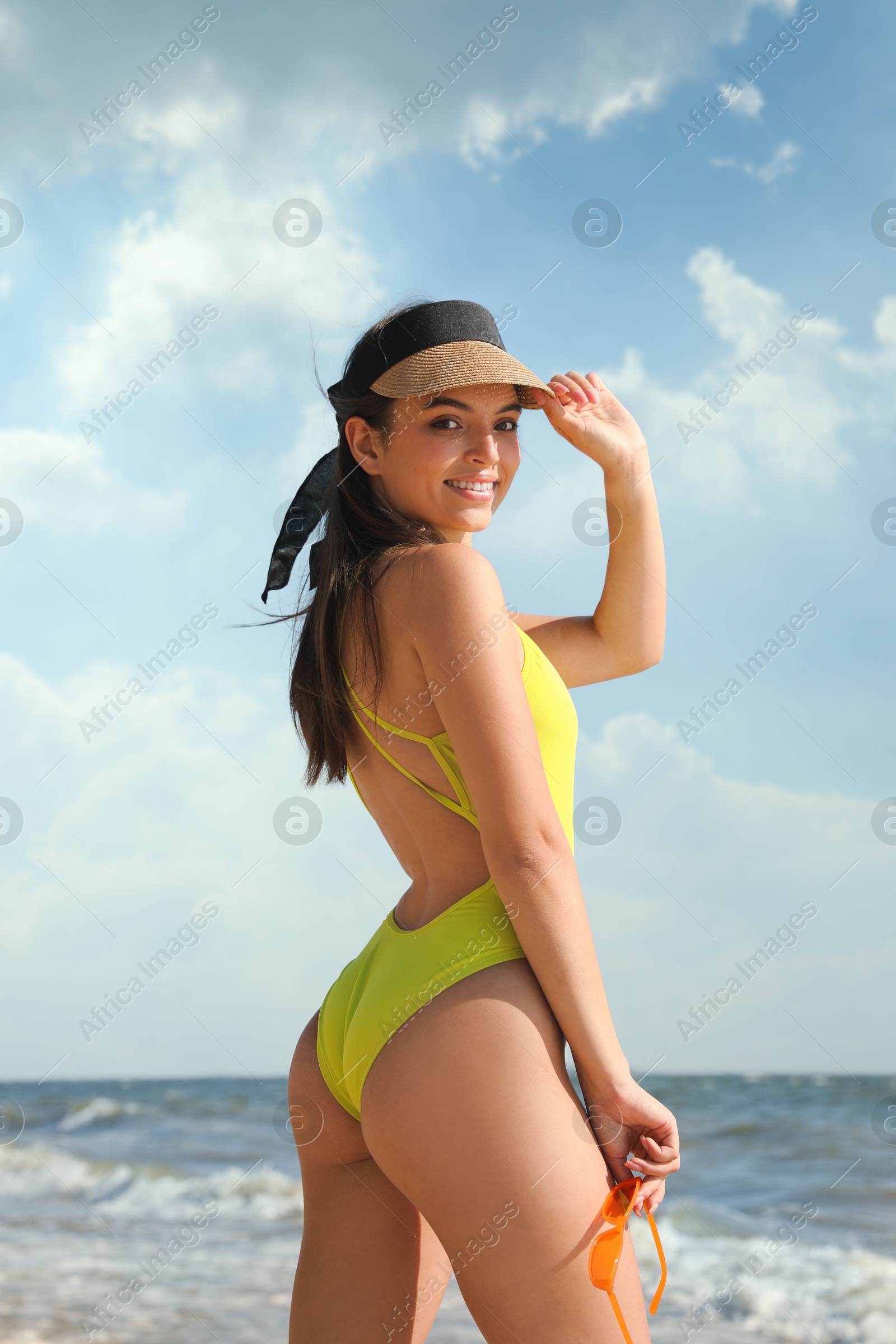 Photo of Beautiful young woman with attractive body on beach