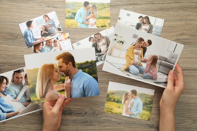 Photo of Woman with different photos at wooden table, top view