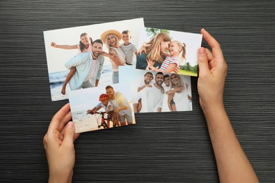 Photo of Woman with different photos at black wooden table, top view